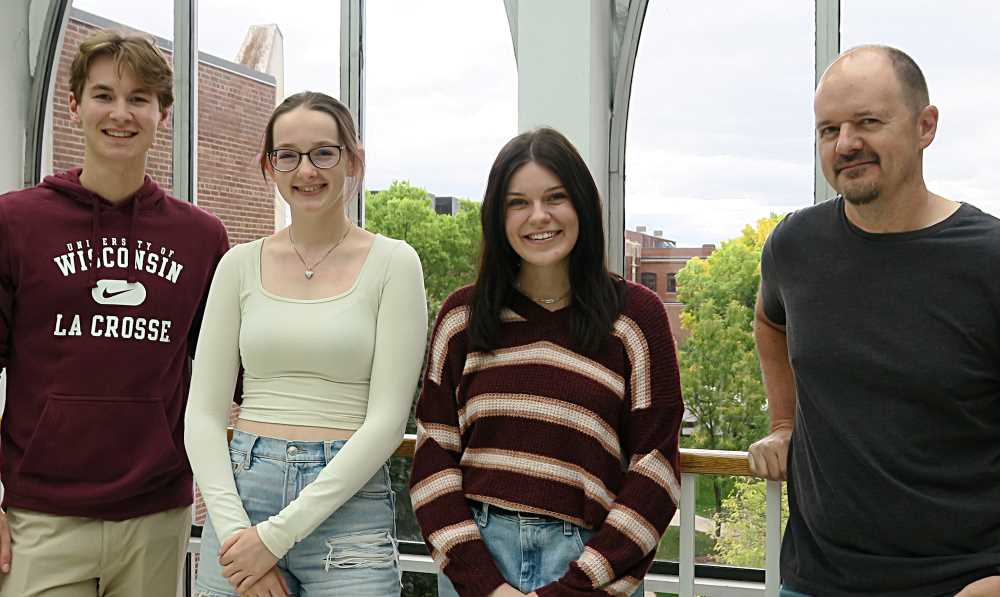 Photo of a team of three UWL undergraduate students in chemistry and biochemistry who are working on the research with mentor Kris Rolfhus (right). They are, from left, William Murphy, a junior biochemistry major; Abigail Jahn, a junior chemistry major; and Katie Peterson, a senior chemistry major with an environmental concentration.