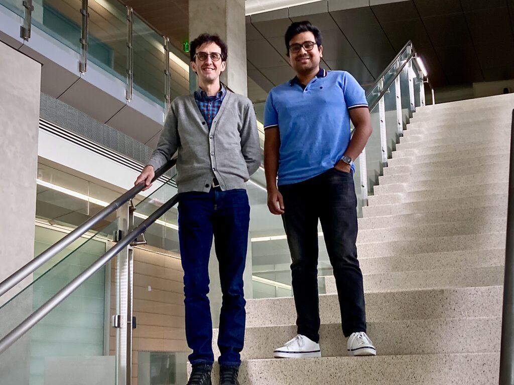 Photo of Professor David Kaplan (left) and Rahul Sengar, a UWM postdoctoral researcher, who are inviting members of the public to help with the search for pulsars. (UWM Photo/Laura Otto)