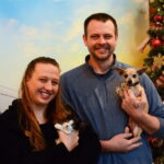 Photo of UW-Green Bay alumni siblings Amanda Reitz and Marcus Reitz posing with a cat and dog at Happily Ever After Animal Sanctuary (HEA) in Green Bay, Wis., on Dec. 4, 2023. Amanda founded HEA in 2006 while still a student, and Marcus joined as director of branding and development in 2015. (Photo by Joey Prestley / UW-Green Bay)