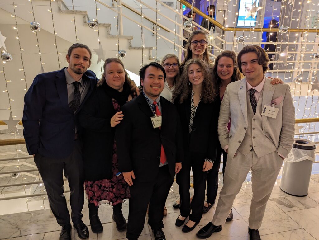 Photo of six students and two advisers who traveled to Erfurt, Germany, to represent UW Oshkosh at a National Model United Nations (MUN) conference in November 2023. (UW Oshkosh photo by Tracy Slagter)