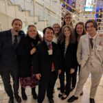 Photo of six students and two advisers who traveled to Erfurt, Germany, to represent UW Oshkosh at a National Model United Nations (MUN) conference in November 2023. (UW Oshkosh photo by Tracy Slagter)