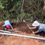 Photo of UW-Stout students part of the university’s Engineers Without Borders chapter who traveled to a village in Ecuador to help build a clean water system. A return trip is planned in 2024 to continue the two-mile-long project. / Photo courtesy of Engineers Without Borders chapter