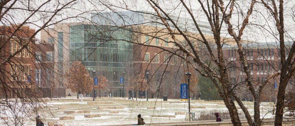 Photo of students making their way through the lower UW-Eau Claire campus during a snowy winter day.