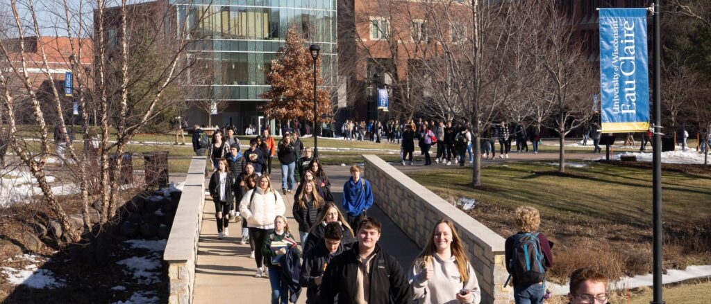 Photo of UW-Eau Claire students walking across bridge