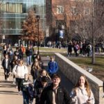 Photo of UW-Eau Claire students walking across bridge