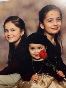 Photo of Karla Sanchez as a child. Growing up in Racine, Wis., Karla (far left) is the middle child of three sisters. (Photo courtesy of Karla Sanchez)