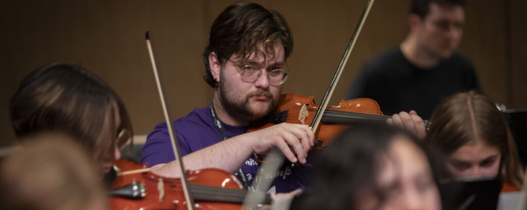 Photo of Charlie Shilhavy, a UW-Whitewater music major from Racine, who was named the 2024 recipient of the Student Exemplary Service Award from the American String Teachers Association as part of the organization’s Student Chapter Awards. (Craig Schreiner/UW-Whitewater)