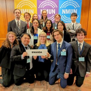 Photo of 14 UWO Model UN delegates, who worked with other students from around the world to address global issues and picked up top awards in the process.