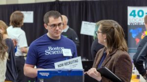 Photo of a UW-Stout student meeting with a recruiter from Boston Scientific at the Spring Career Conference. Recent graduates reported a $58,000 average salary and 99% employment rate. / UW-Stout