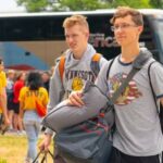 Photo of high school students arriving on campus and checking in at the dorms for the Badger Boys State camp. UW-Eau Claire hosts multiple sports camps and will be adding the new Scheels Sport For All Camp this summer. (UW-Eau Claire)