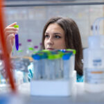 Photo of Anna Brooks working on a research project in a UW-Stout lab. / UW-Stout