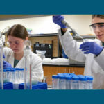 Photo of two UWGB undergraduate students conducting freshwater research