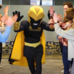 Screenshot of UWO mascot, Clash the Titan, on a Mascots on Main visit to E-Power Marketing, a local business employing UWO alumni