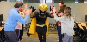 Screenshot of UWO mascot, Clash the Titan, on a Mascots on Main visit to E-Power Marketing, a local business employing UWO alumni