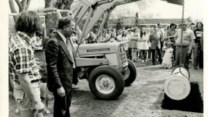 Photo of a crowd of onlookers watching as the Centennial Time Capsule is lowered into the ground on May 13, 1975. UWRF Archives.