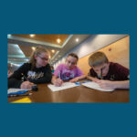 Photo of middle school students solving math contest problems (UWO)
