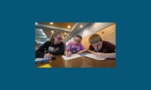 Photo of middle school students solving math contest problems (UWO)