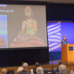 Photo of UW-Stout Assistant Professor Michael Tetzlaff, at podium, and students Chloe Ferguson and Luke Denney, giving a presentation about Kintsugi 3D at Research Day, May 6, 2025.