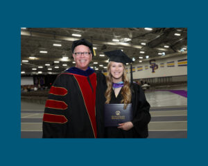 Photo of Perry and Stephanie Cook at the May 2025 commencement ceremony, where Perry was able to present his daughter with her diploma.