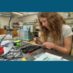 Photo of UWEC student doing Parkinson's glove research
