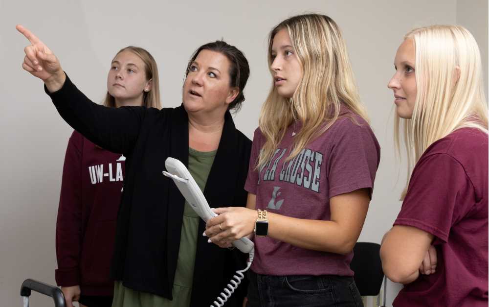 Photo: One of the fastest growing areas in Health Professions is Radiologic Sciences. From left, UWL student Ally Richarson, Director of Radiologic Sciences Melissa Weege, and UWL students Maddy Benson and Emma Strassburg are using VERT- radiation therapy virtual reality software.
