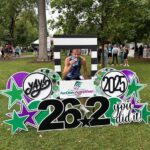 Photo: John Thill shows off the hardware he took home after winning the Fox Cities Marathon.