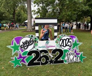 Photo: John Thill shows off the hardware he took home after winning the Fox Cities Marathon.