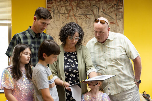 Photo: Mary “Christina” Moodie’s family and members of UW-Oshkosh faculty and staff took part in a recent ceremony awarding her bachelor’s degree posthumously.