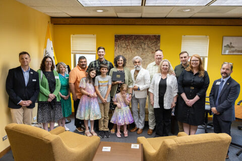 Photo: Mary “Christina” Moodie’s family and members of UW-Oshkosh faculty and staff took part in a recent ceremony awarding her bachelor’s degree posthumously.