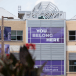 Photo of UW-Whitewater campus with sign: "You belong here."