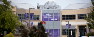 Photo of UW-Whitewater campus with sign: "You belong here."