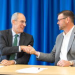 Photo of signing agreement