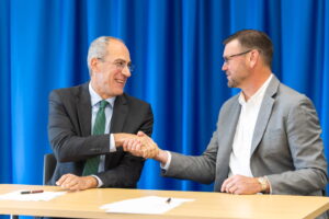 Photo of signing agreement