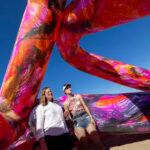 Photo: Associate Professor Whitney Moon (left) and UWM student Kirsten Josefchuk are surrounded by inflatable art inspired by designs by students in a seminar taught by Moon. (UWM Photo/Troye Fox)