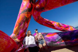 Photo: Associate Professor Whitney Moon (left) and UWM student Kirsten Josefchuk are surrounded by inflatable art inspired by designs by students in a seminar taught by Moon. (UWM Photo/Troye Fox)