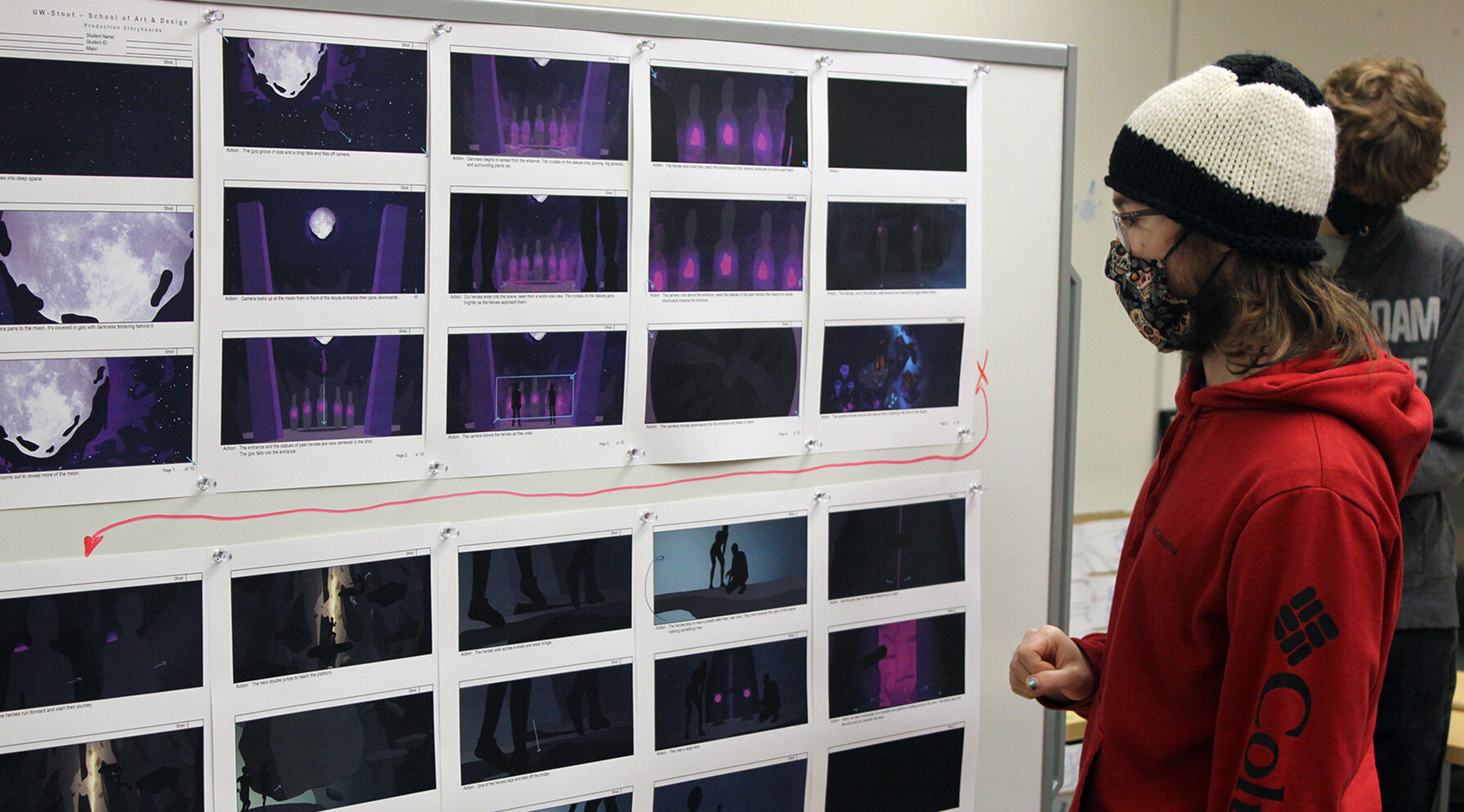 Photo of student Jonah Hammen studying a storyboard in the Animation Production class. / UW-Stout photo