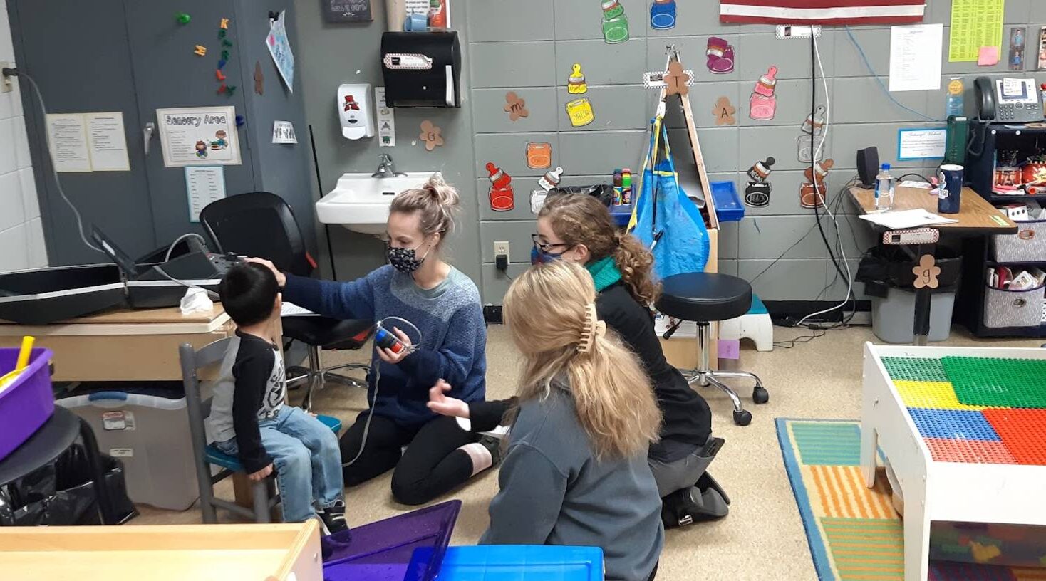 Blugolds come together to provide hearing screening to young children in Arcadia