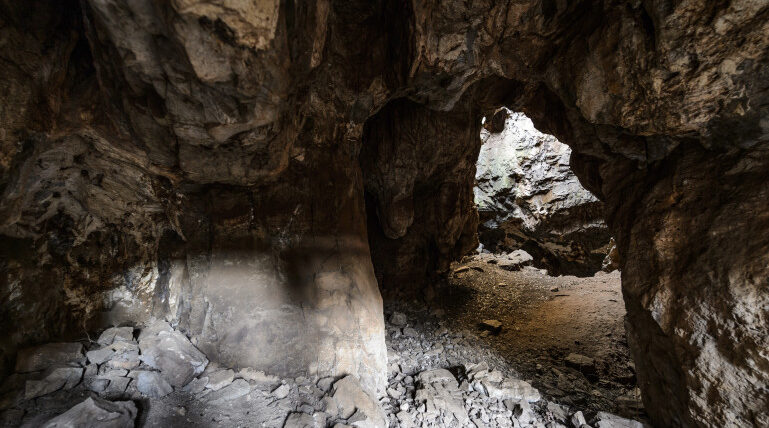 Archaeologists uncover evidence of intentional burial, cave engravings by early human ancestor