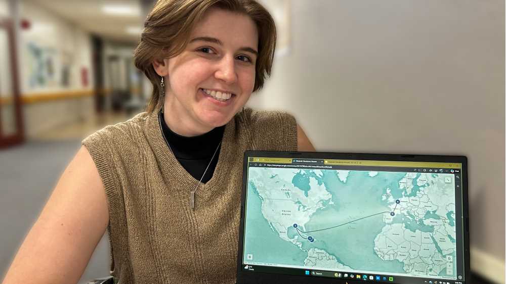 Photo of UWL Senior Elin Voegeli, who shares the immigration journey of Elisabeth Dieudonné Vincent using ArcGIS Storymaps, a web-based, interactive map that blends text, images and video.