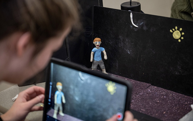 Photo: Grace Simon-Dupuis, a St. Croix Falls High School senior, creates a frame-by-frame clay animation video during the Visual Arts Classic, held Feb. 27 at UW-River Falls. UWRF photo.