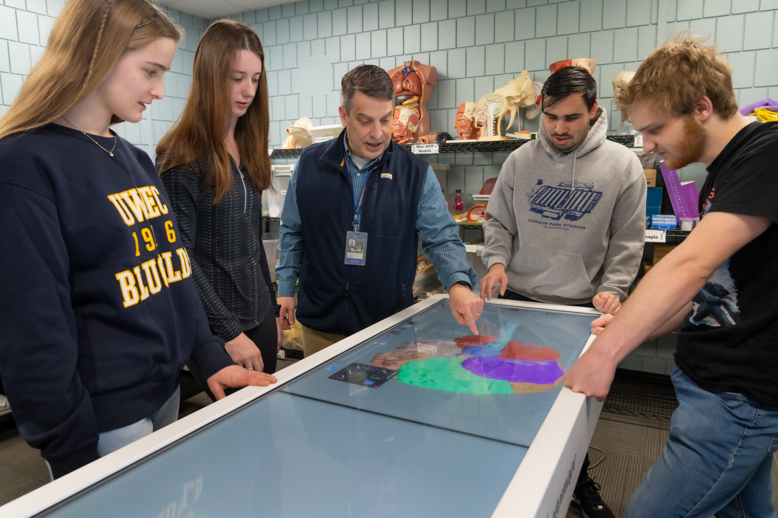 Photo: Mayo Health System medical professional, speech language therapist, Thomas Sather, discussed the human brain using anatomage technology with honors students during an honors class. Sather's is also an associate professor in the Communication and Sciences Disorders department.