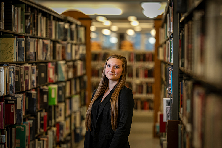 Photo: Naomi Kraut, a technical services supervisor at Milwaukee Public Library, received course credit for her library work, which allowed her to graduate a semester early. (UWM Photo/Andy Manis)