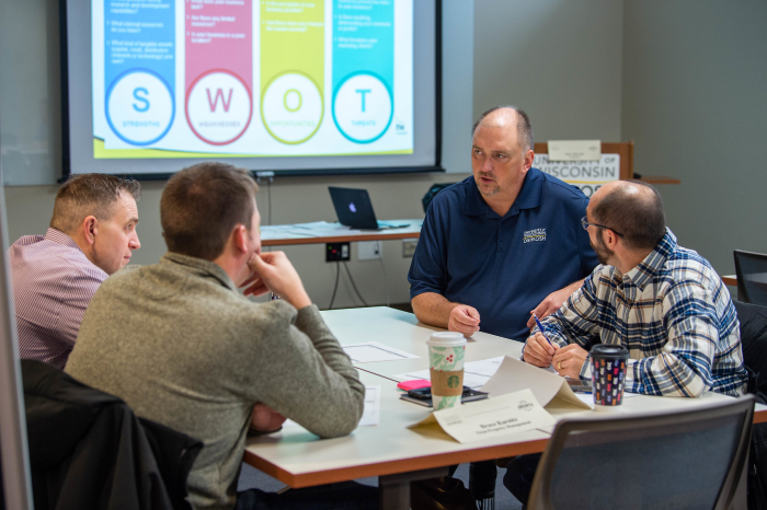 Photo of participants in a new program launching in Oshkosh to help small businesses generate new products.