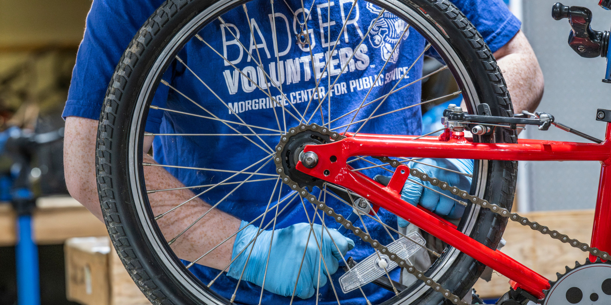 Photo of UW-Madison Badger Volunteers repairing a bicycle