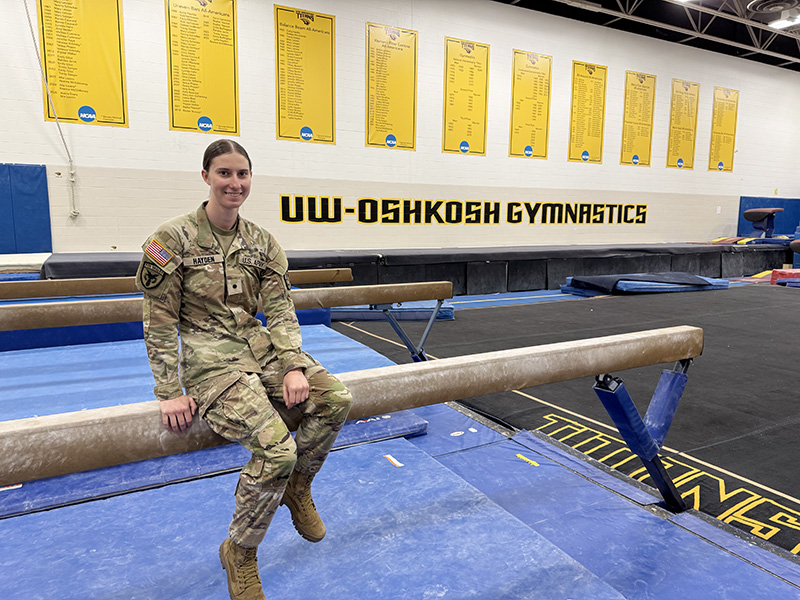 Photo: Lydia Hayden, a graduating University of Wisconsin–Oshkosh senior who excelled at collegiate gymnastics and as a cadet in the Army ROTC, will embark on her military career as a field artillery officer.