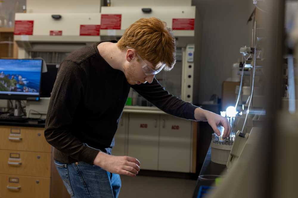 Dylan McCathie, UWL junior and biochemistry major, grows proteins in the lab in the Prairie Springs Science Center.