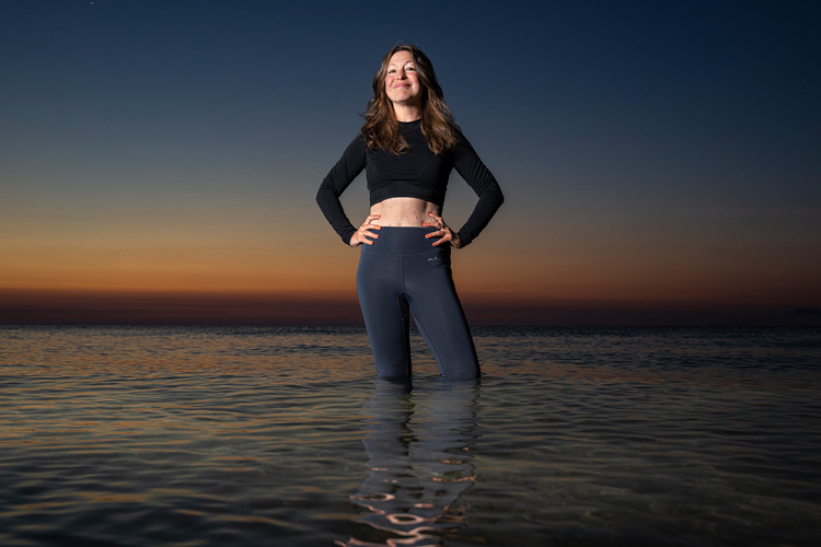 Photo: Ashley Lemke, an archaeologist and associate professor in UWM's anthropology department, poses for a portrait in Lake Michigan. (UWM Photo/Andy Manis)