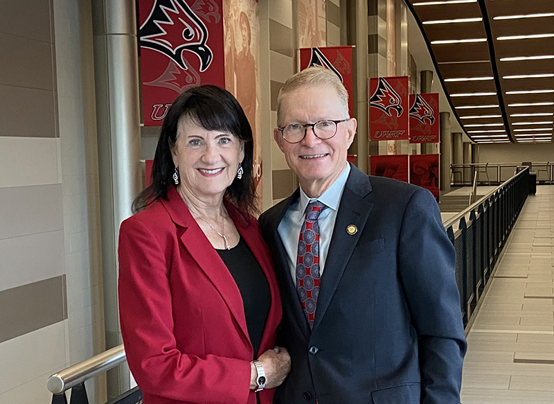 Photo: Paul and Karen Dykstra pose for a photo in the UW-River Falls Falcon Center. Paul Dykstra, a 1983 graduate, two-sport athlete and longtime supporter of UWRF, will donate $1 million to establish the Falcon Athletics Endowment for Excellence focused on enhancing student-athletes’ intercollegiate athletics experience.