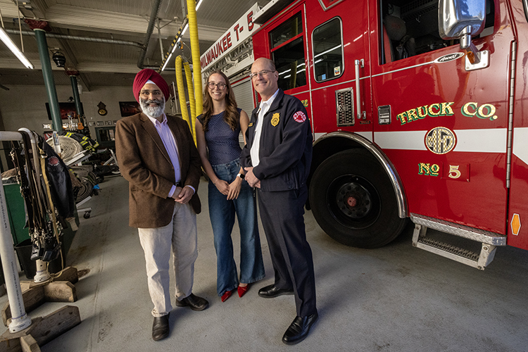 Photo: Milwaukee Fire Chief Aaron Lipski (right) says emergency medical responders face increasingly high levels of psychological difficulty in doing their jobs. So he was thrilled when his daughter, Bella, began working with Bhagwant Sindhu on a project at UWM to find ways to manage that stress. (UWM Photo/Troye Fox)