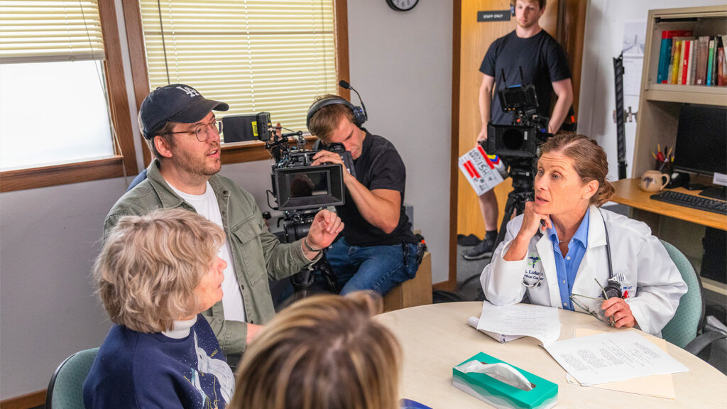 Photo: Nathan Deming (center left) directs Colleen Madden (center right) in a scene from 'Winter Hymns.' Photo by Nathan Ouellette.